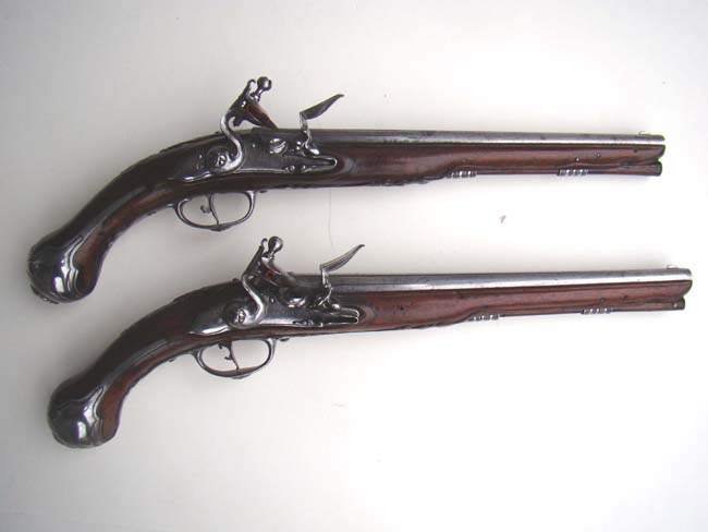 A pair of late 17th century Italian steel mounted flintlock officers' pistols circa 1695